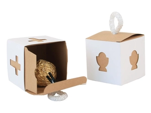 Detail view showing white hollow-out gift box with cross pattern and cotton rope handle