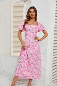Detailed view of puff sleeves and square neckline on a pink floral midi dress