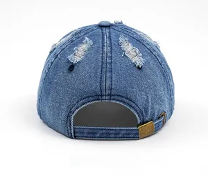 Rear view of washed denim baseball cap with distressed finish and adjustable metal buckle