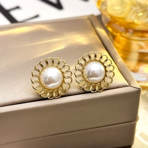 French vintage pearl stud earrings with golden flower petals and elegant metallic finish