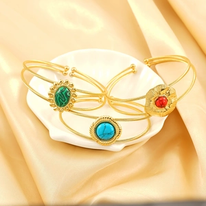 Golden titanium steel wire cuff bracelet set with green, blue, and red turquoise stones