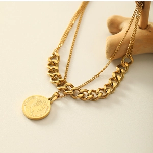 Close-up of double-layered 18k gold-plated necklace with Elizabeth coin pendant