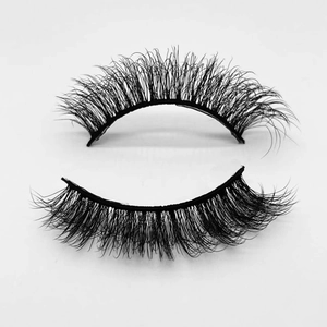 Macro shot of thick curled black faux mink eyelashes with dense clustered arrangement