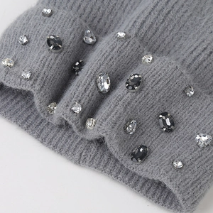 Detail of gray ribbed knit beanie featuring sparkling mixed shape rhinestones and crystals