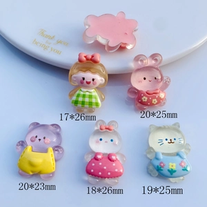 Macro detail of assorted resin DIY charms like bears and rabbits with size dimensions