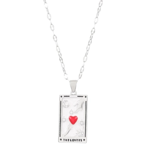 Detailed macro view of silver Tarot The Lovers necklace featuring a red heart pendant