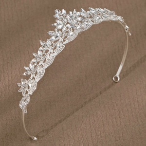 Elegant silver bridal crown with crystal rhinestones and floral leaf patterns for weddings