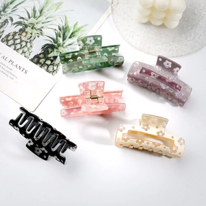 Five-piece set of floral PVC hair claws in pastel colors with matte and shimmer finish