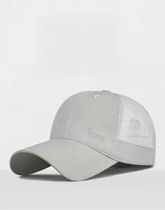 Detail view of breathable white mesh and 'Sport' embroidery on light gray sun cap