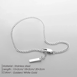 Detail of adjustable stainless steel Cuban link bracelet with lobster clasp and engravable tag