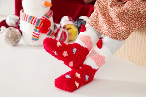 Thick coral fleece Christmas socks for kids featuring festive 3D red ears and plush texture
