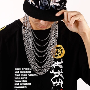 Multi-layered silver titanium steel NK chains on model showing stylish hip hop layering