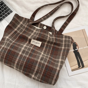 Top view of vintage brown plaid canvas tote bag with magnetic clasp and fabric straps