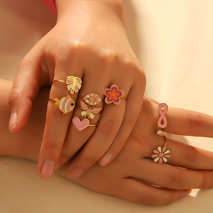 Golden titanium steel rings set with colorful enamel flowers and heart patterns