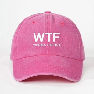 Detailed close-up of pink washed cotton baseball cap with white WTF lettering