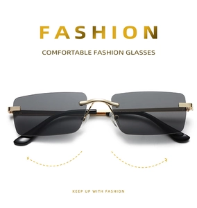 Detail view of rimless square sunglasses with grey gradient lenses and gold metal temples
