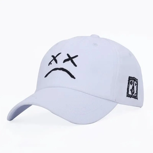Unisex white cotton baseball cap with artistic black face embroidery and side patch