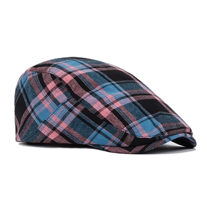 Detail of blue and pink plaid cotton ivy cap showing textured fabric and curved brim