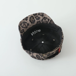 Detail view of leopard print baby cap with Nice embroidery under the soft brim