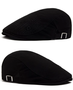 Detail of adjustable silver buckle and cotton fabric on a black newsboy hat for men