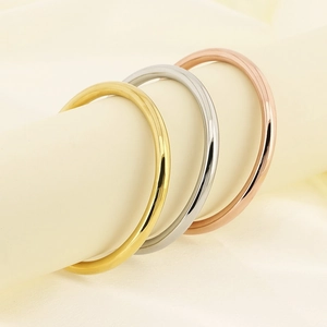 Minimalist 6mm stainless steel round bangles in gold, silver, and rose gold finishes