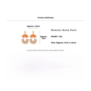 Detail view of U-shaped geometric earrings made of resin and wood with size and weight specs