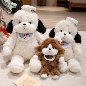 Cute plush puppy toy set with floral bibs and lace hats on a warm cozy carpet