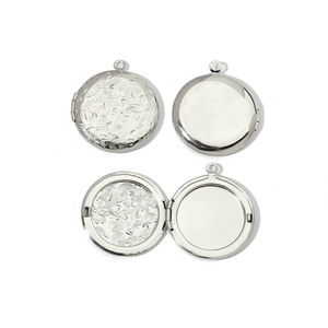 Polished silver heart locket showing closed engraved design and open photo compartment