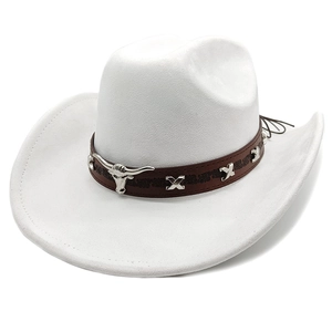 Detail of white western cowboy hat featuring leather band with silver bull head emblem