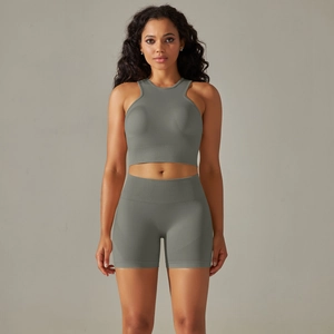 Women's seamless two-piece yoga set with olive crop top and high waist shorts