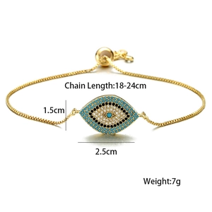 Detail of adjustable gold evil eye bracelet with blue, white and black zircon stones