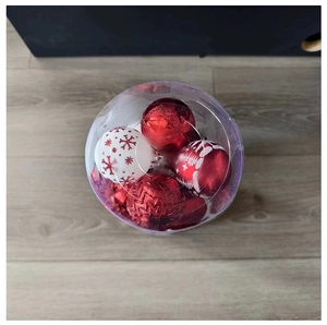 Top view of red and white Christmas ornaments with snowflake and geometric patterns