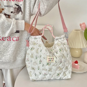 Detailed quilted canvas bag with cartoon rabbit floral pattern and colorful rope handles
