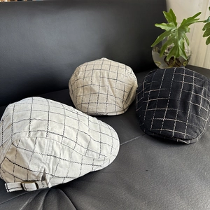 Detailed comparison of three plaid linen newsboy caps in white, beige and black tones