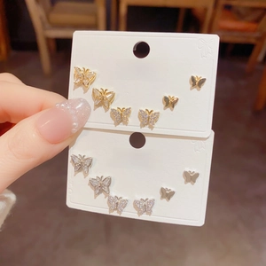 Three-piece butterfly stud earring set in gold and silver finish with sparkling zircon