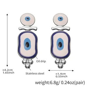 Detail view of blue enamel evil eye earrings showing size measurements and stainless steel material