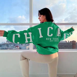 Sweat-shirt vert surdimensionné avec imprimé Chicago New York au dos du vêtement