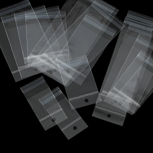 Macro view of clear self-sealing OPP bags with hanging holes for jewelry packaging