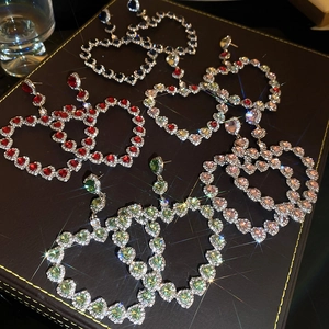 Exaggerated rhinestone heart earrings in multiple colors with luxury sparkling finish