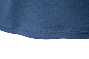 Detailed close-up of blue fleece hoodie hem showing high-quality double-needle stitching