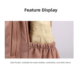 Detailed view of pink nylon backpack side elastic pocket holding a yellow folding umbrella