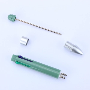 Exploded view of DIY beaded ballpoint pen components in green plastic and silver metal