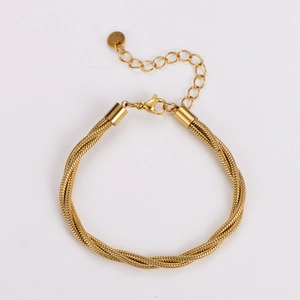 Detail of a gold multi-strand braided snake chain bracelet with lobster clasp and round tag