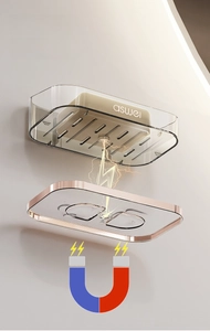 Detail view of magnetic drainage soap dish with transparent tray and gold metal frame