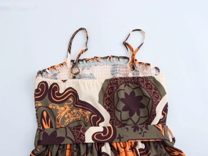 Close-up of bohemian floral dress showing elasticated smocked bodice and adjustable straps