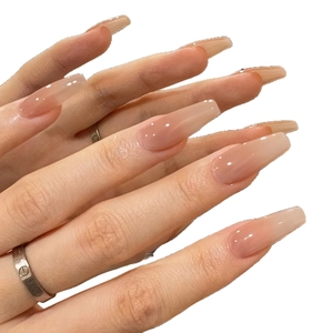 Long coffin-shaped press-on nails featuring a nude pink ombre gradient and glossy finish