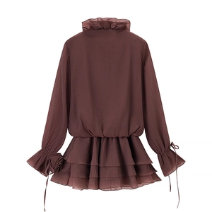 Detailed back view of dark brown ruffle dress with lantern sleeves and tiered skirt details