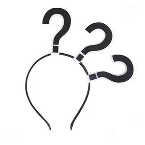 Detail of Halloween headband with black and white question mark motifs on a slim band