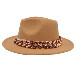 Detail of camel wool fedora hat featuring a chunky rose gold acrylic chain accent
