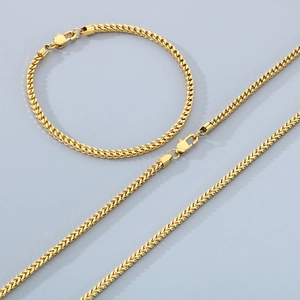 Close-up of golden stainless steel dragon bone chain set with secure lobster clasps
